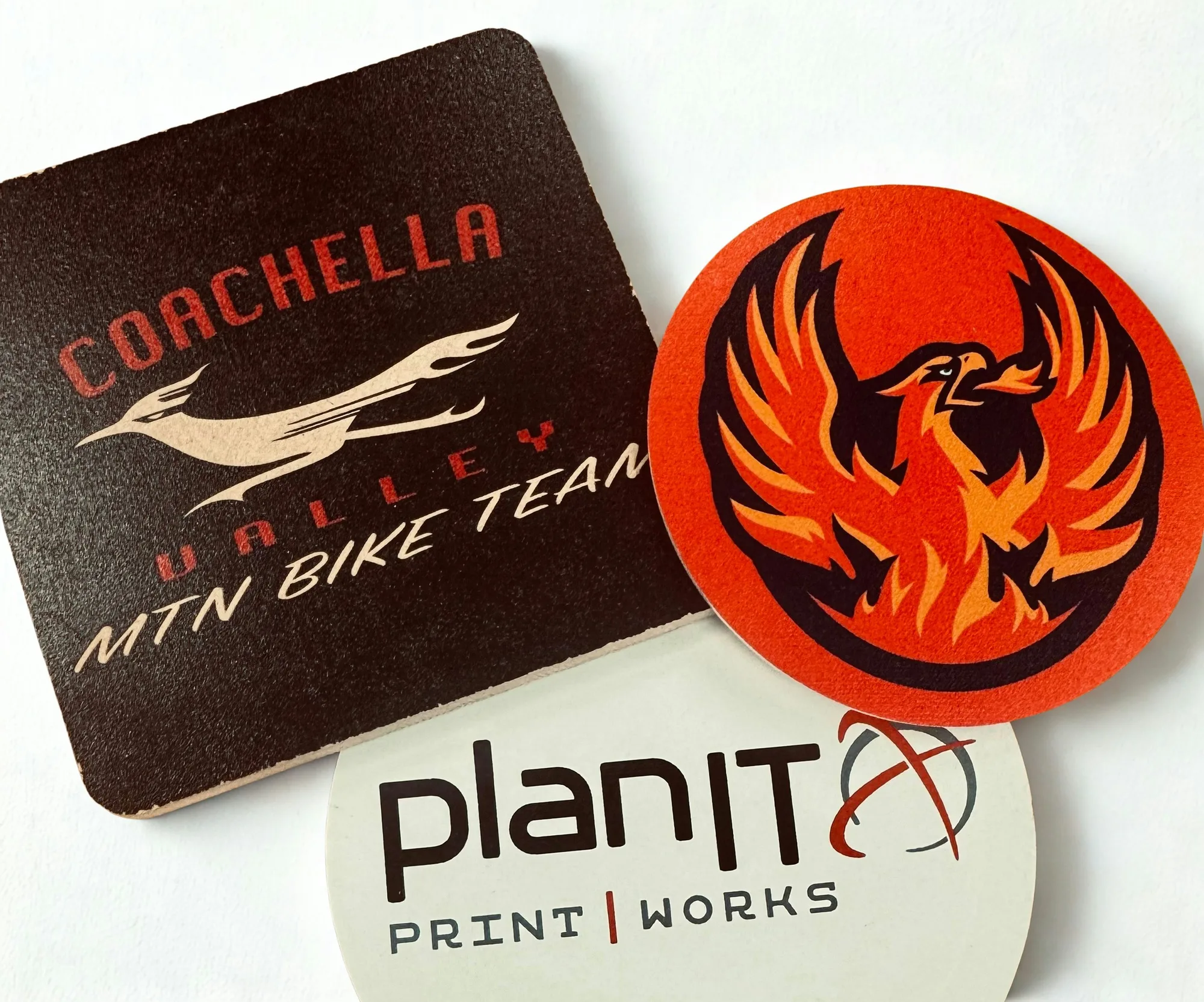 Bamboo and bike chain coasters engraved with team logos
