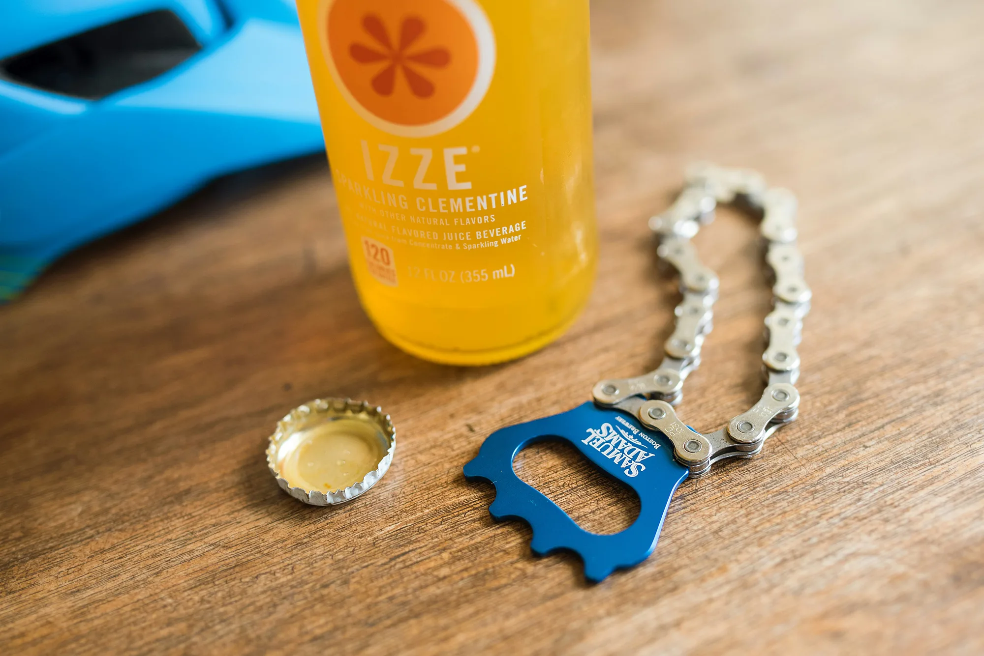 Bike chain bottle opener beside an open soda
